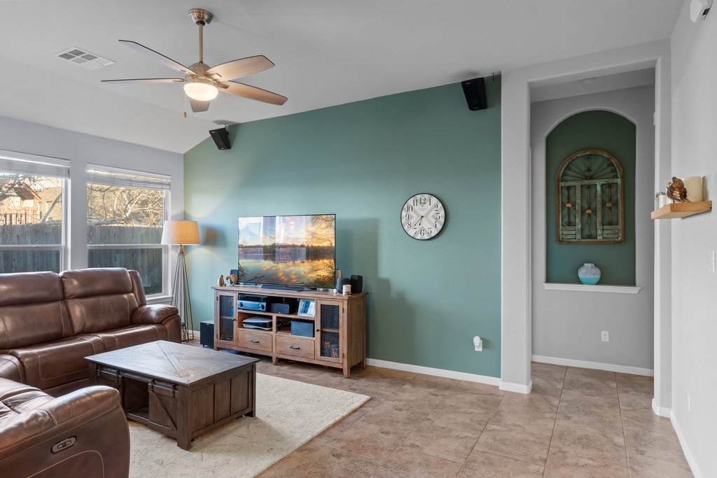 2902 Tempe Drive Cedar Park, TX 78641 - Photo 14 of 38 Living room with vaulted ceiling and ceiling fan
