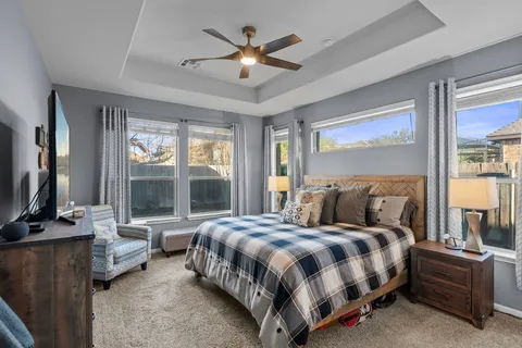 a bedroom with a bed and a lamp