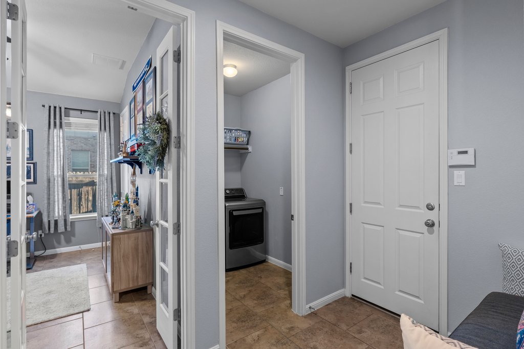 2902 Tempe Drive Cedar Park, TX 78641 - Photo 24 of 38 Hallway featuring washer / clothes dryer and baseboards