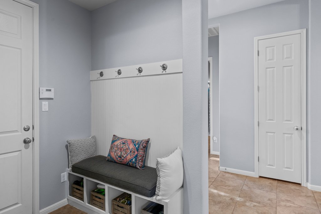 2902 Tempe Drive Cedar Park, TX 78641 - Photo 25 of 38 Mudroom featuring baseboards and light tile patterned flooring