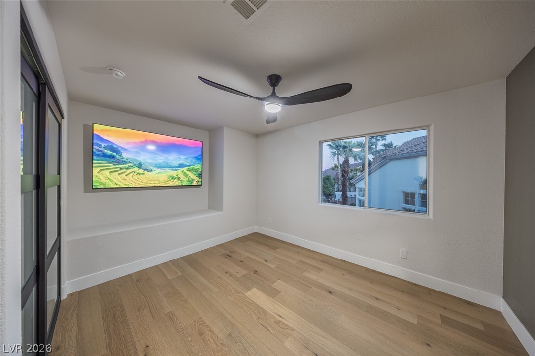 8800 Lusso Las Vegas, NV 89134 - Photo 74 of 85 Empty room featuring light wood-style floors and ceiling fan