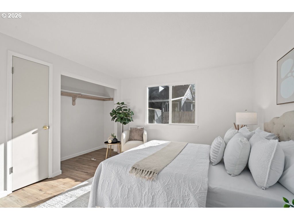 4482 Southwest 179th Avenue Beaverton, OR 97078 - Photo 19 of 37 a bedroom with a bed and a large window