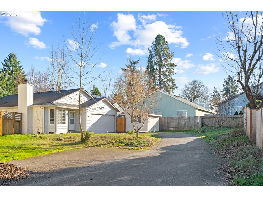4482 Southwest 179th Avenue Beaverton, OR 97078 - Photo 2 of 37 a front view of a house with a yard