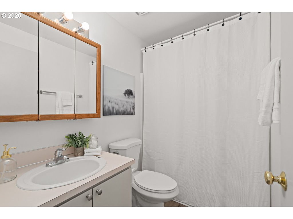 4482 Southwest 179th Avenue Beaverton, OR 97078 - Photo 25 of 37 a bathroom with a sink toilet and mirror