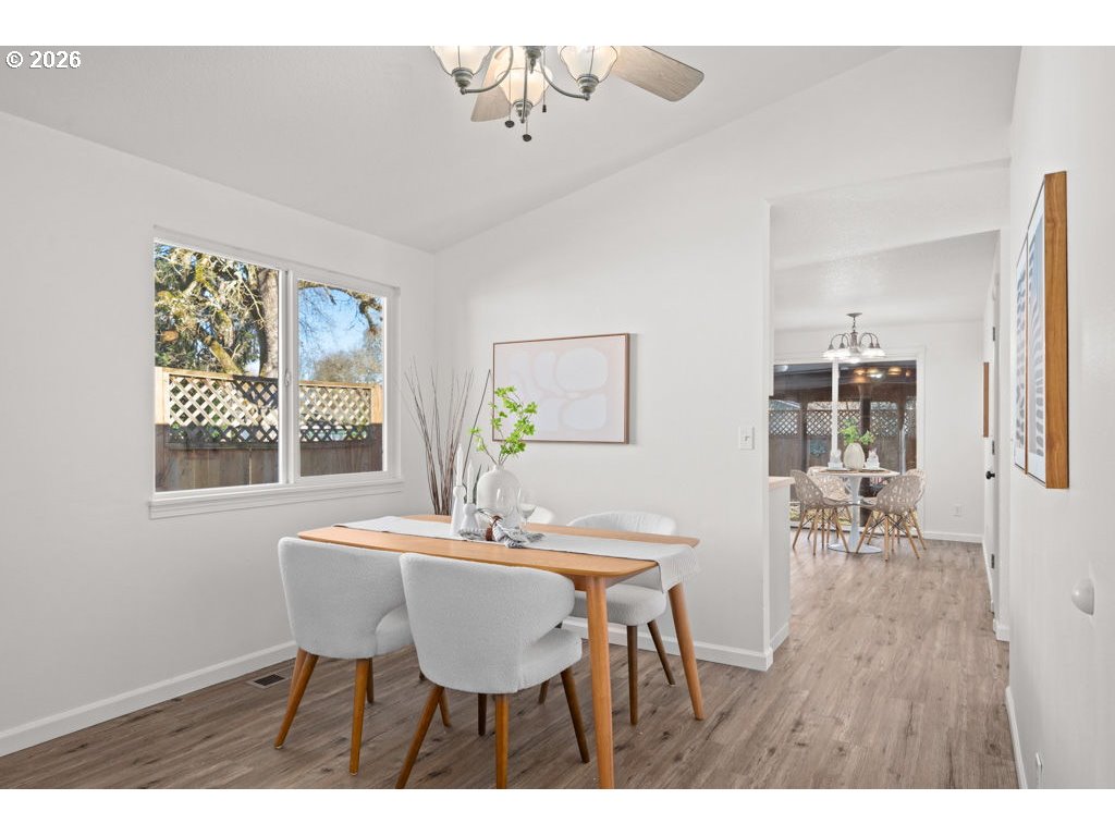 4482 Southwest 179th Avenue Beaverton, OR 97078 - Photo 8 of 37 a view of a dining room with furniture and wooden floor