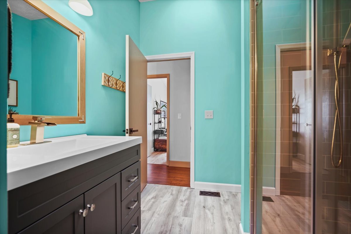 2719 Arrowhead Drive Bloomington, IL 61704 - Photo 13 of 26 a bathroom with a sink and a mirror