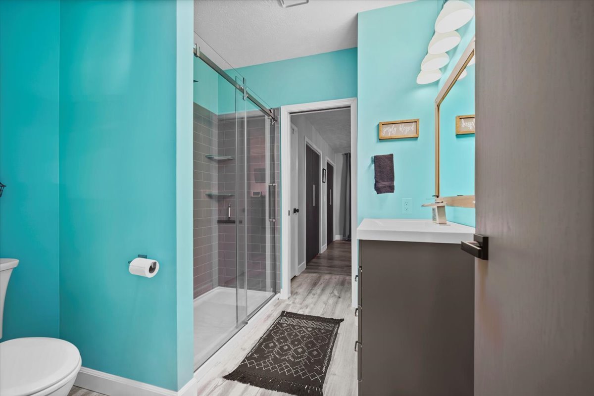 2719 Arrowhead Drive Bloomington, IL 61704 - Photo 14 of 26 a bathroom with a toilet a sink and shower