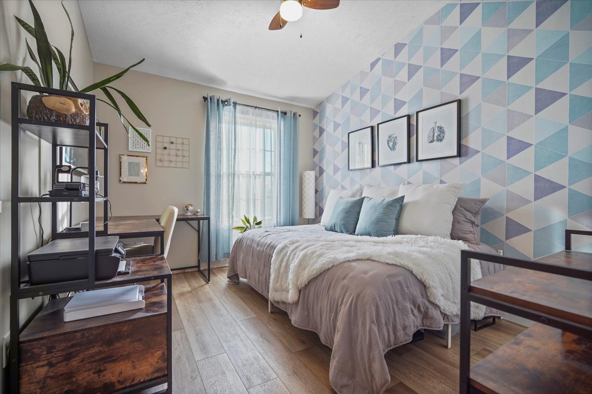 2719 Arrowhead Drive Bloomington, IL 61704 - Photo 15 of 26 a bed room with a bed and a chair