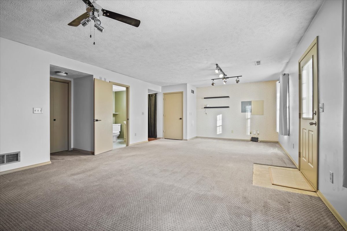 2719 Arrowhead Drive Bloomington, IL 61704 - Photo 18 of 26 a view of empty room with windows and ceiling fan