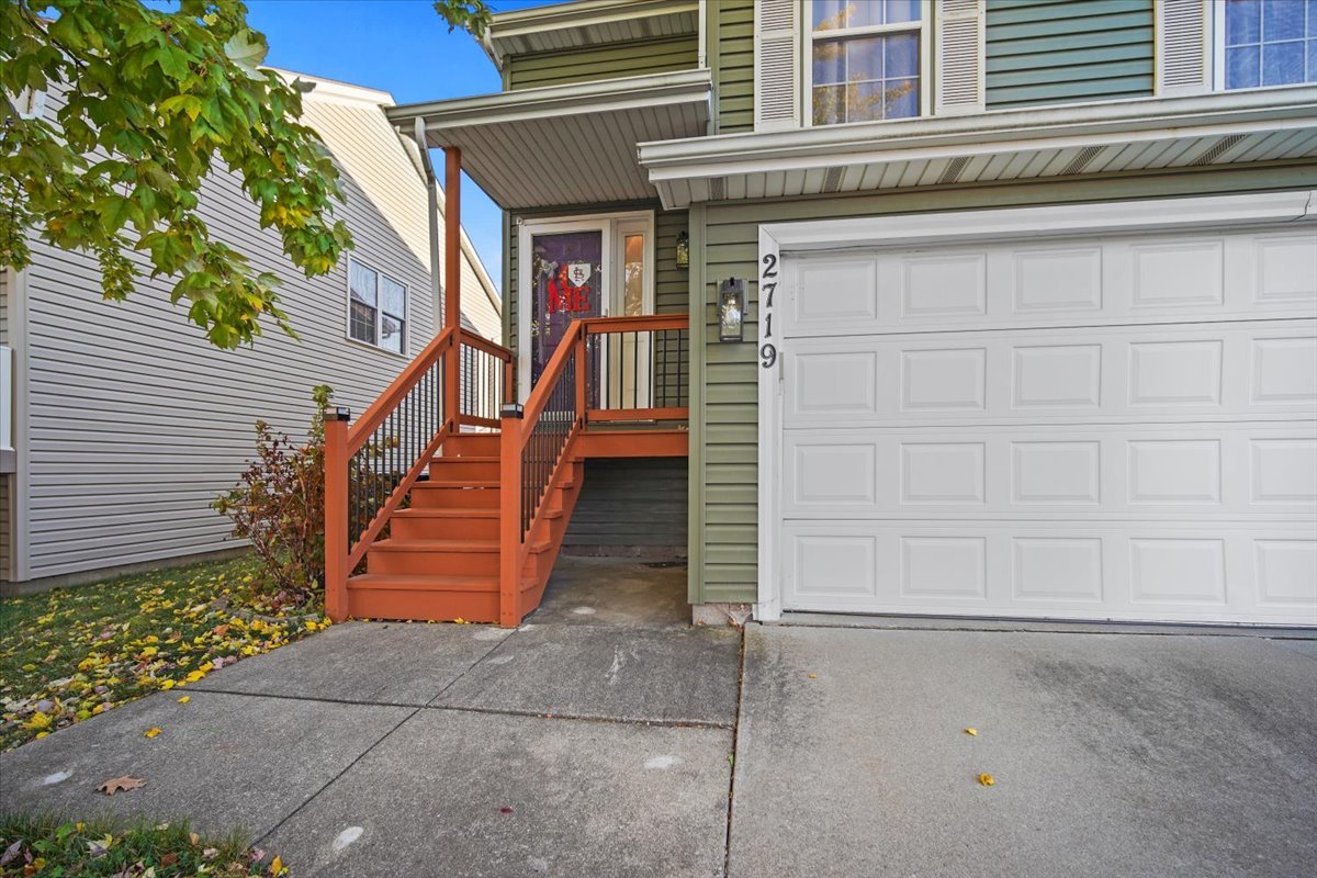 2719 Arrowhead Drive Bloomington, IL 61704 - Photo 2 of 26 front view of a house with a street