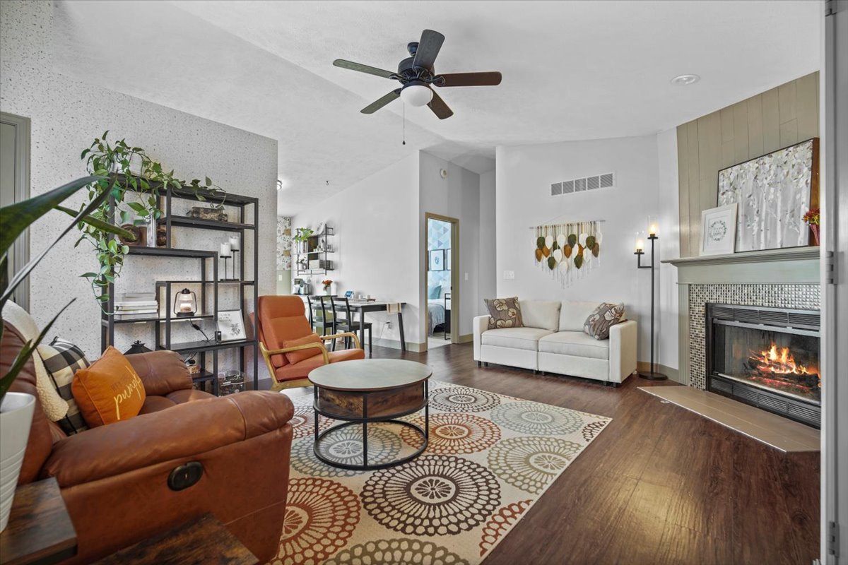 2719 Arrowhead Drive Bloomington, IL 61704 - Photo 5 of 26 a living room with furniture and a fireplace