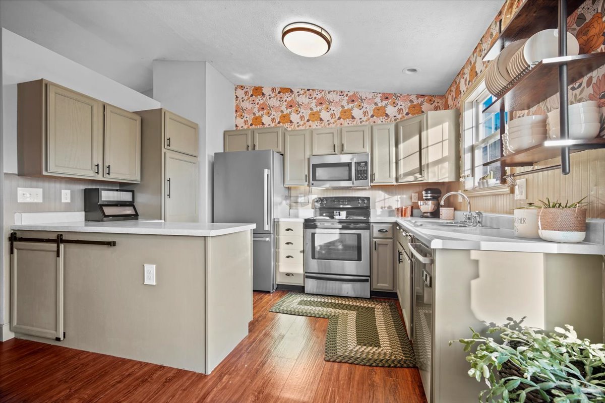 2719 Arrowhead Drive Bloomington, IL 61704 - Photo 8 of 26 a kitchen with granite countertop a refrigerator stove and sink