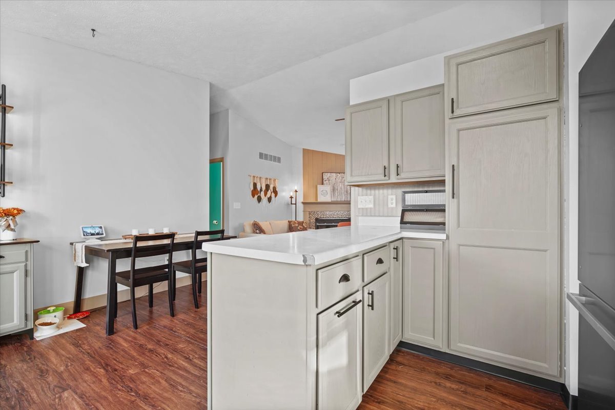 2719 Arrowhead Drive Bloomington, IL 61704 - Photo 9 of 26 a kitchen with a stove a refrigerator and a dining table