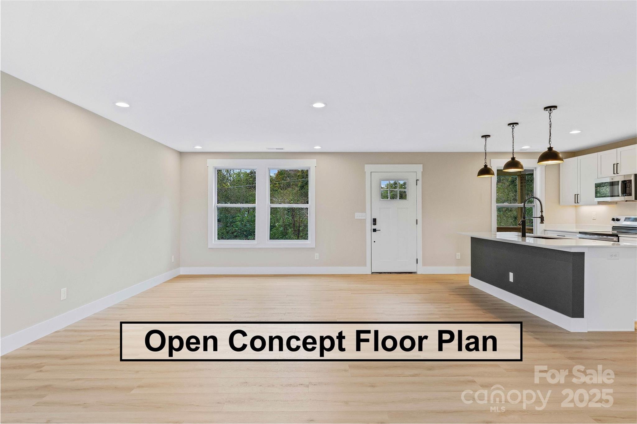 74 Ridge Way Marion, NC 28752 - Photo 14 of 45 a view of kitchen with stainless steel appliances granite countertop a stove a sink and a refrigerator with wooden floor