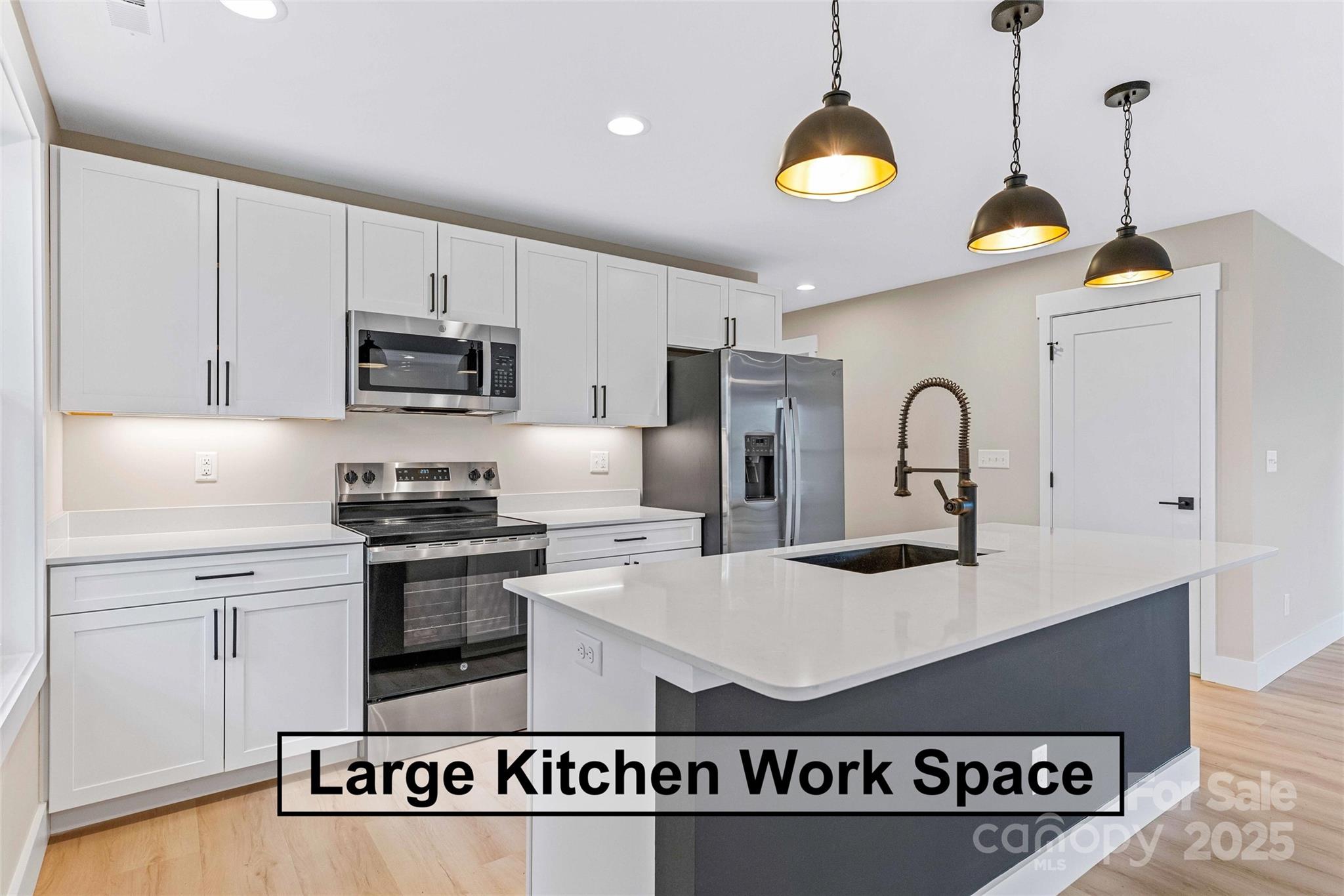 74 Ridge Way Marion, NC 28752 - Photo 20 of 45 a kitchen with kitchen island a counter space a sink appliances and cabinets