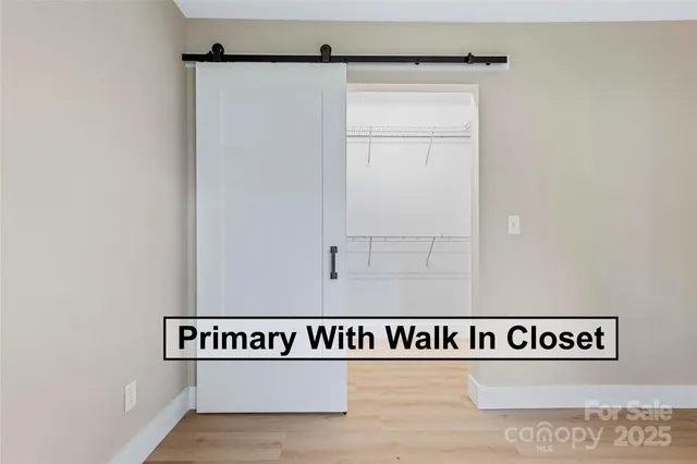 a living room with furniture and painting on the wall