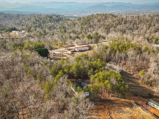 a view of residential houses with outdoor space
