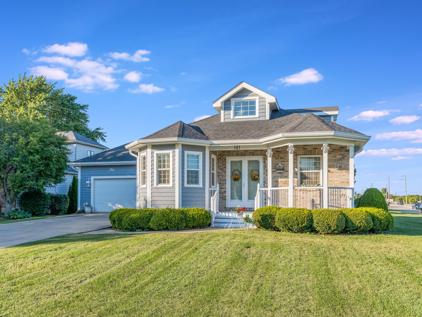 a front view of a house with a yard