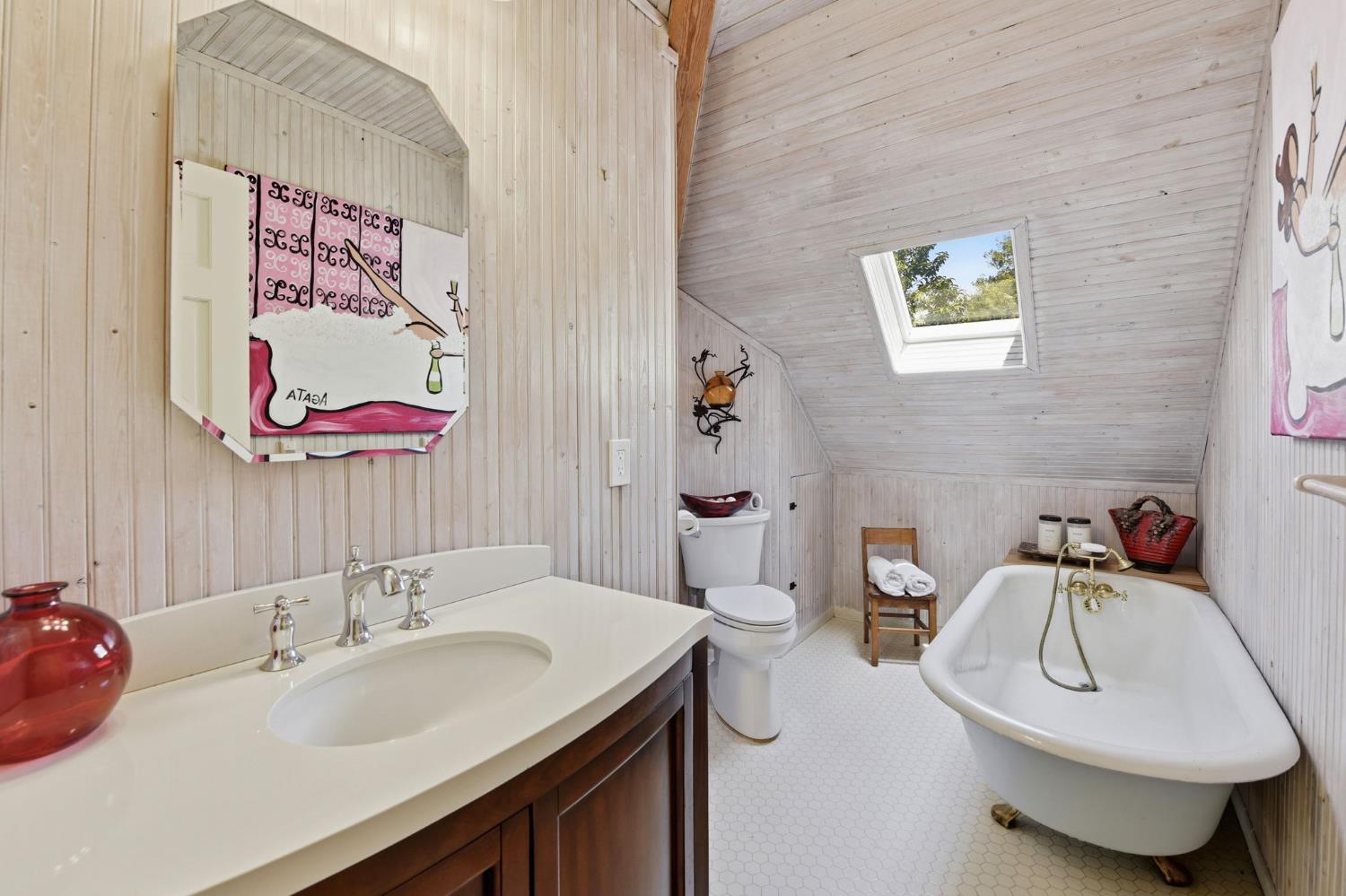 7201 Happy Valley Road Somerset, CA 95684 - Photo 31 of 75 The upstairs guest bathroom is light and brigt with a skylight and a claw foot tub for soaking.