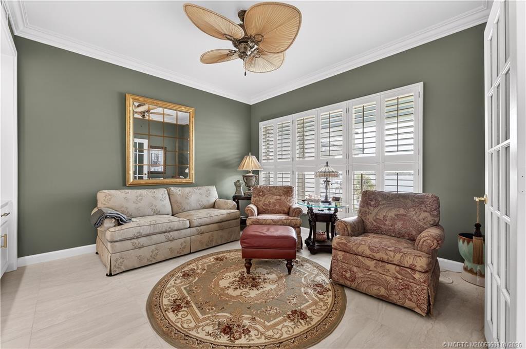 12500 Harbour Ridge Boulevard, Unit 48 Palm City, FL 34990 - Photo 17 of 28 a living room with furniture and a large window