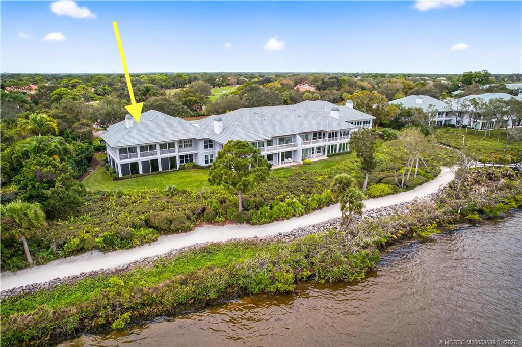12500 Harbour Ridge Boulevard, Unit 48 Palm City, FL 34990 - Photo 22 of 28 a view of a house with a garden