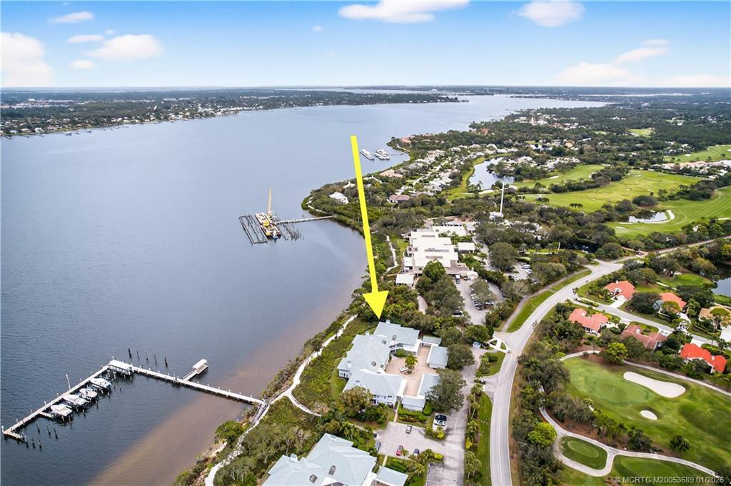 12500 Harbour Ridge Boulevard, Unit 48 Palm City, FL 34990 - Photo 25 of 28 an aerial view of a house with a lake view