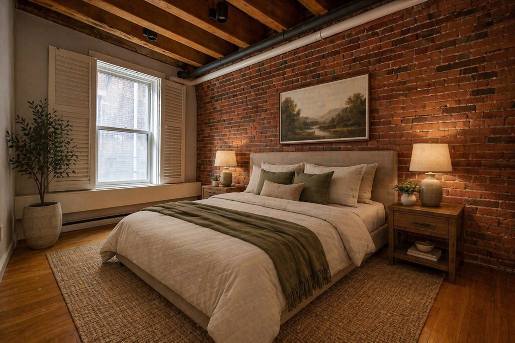 154 Commercial Street, Unit 2 Boston, MA 02109 - Photo 4 of 6 a bedroom with a bed wooden floor and window