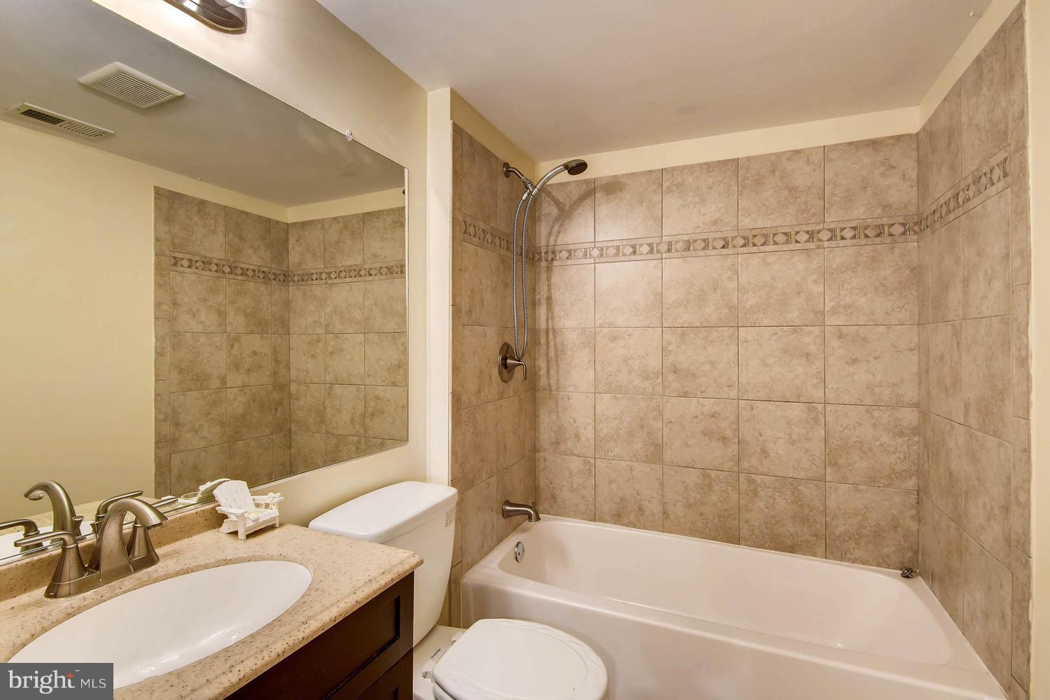 3106 River Drive Road Baltimore, MD 21219 - Photo 22 of 30 a bathroom with a sink toilet bathtub and shower