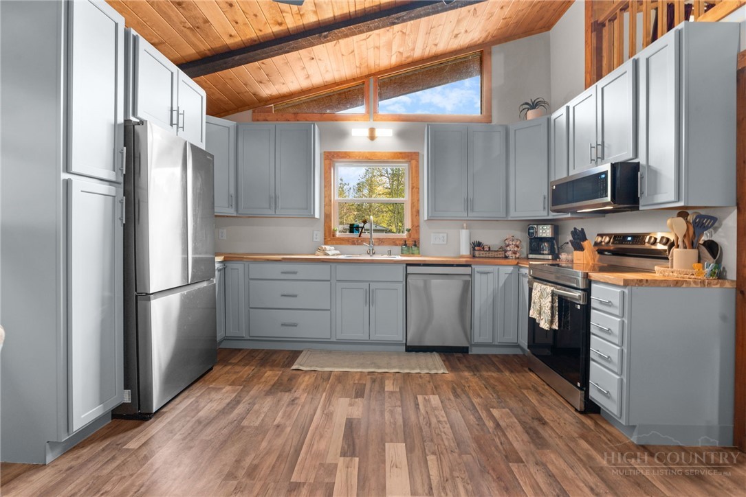 139 Golden Rod Loop Newland, NC 28657 - Photo 11 of 39 a kitchen with stainless steel appliances a refrigerator sink and microwave