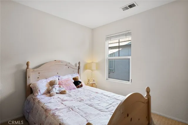 a bathroom with a toilet a sink and a mirror
