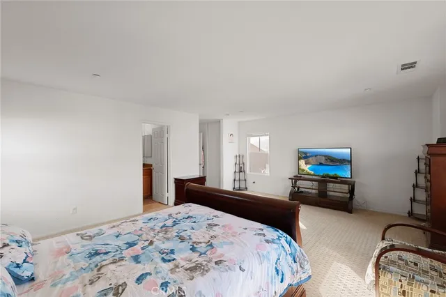 a bedroom with furniture and a window