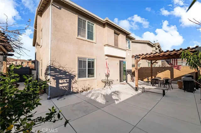 a view of outdoor space with seating area and barbeque oven