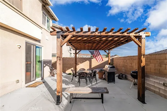 an aerial view of a residential houses with outdoor space and lake view