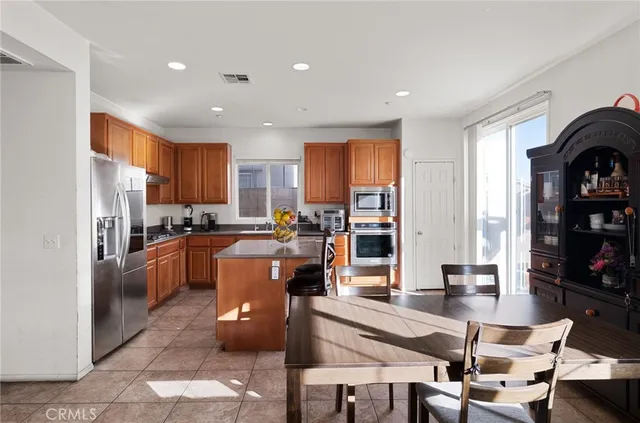 a view of a dining room with furniture and window