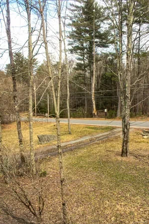 a view of a pool with a yard