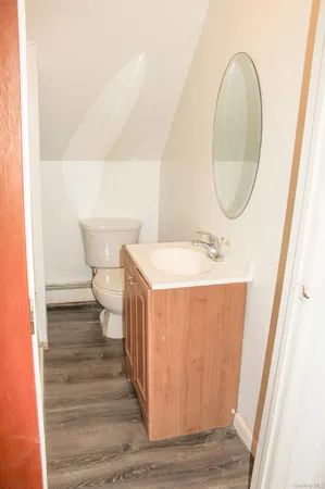 a bathroom with a sink a vanity and shower