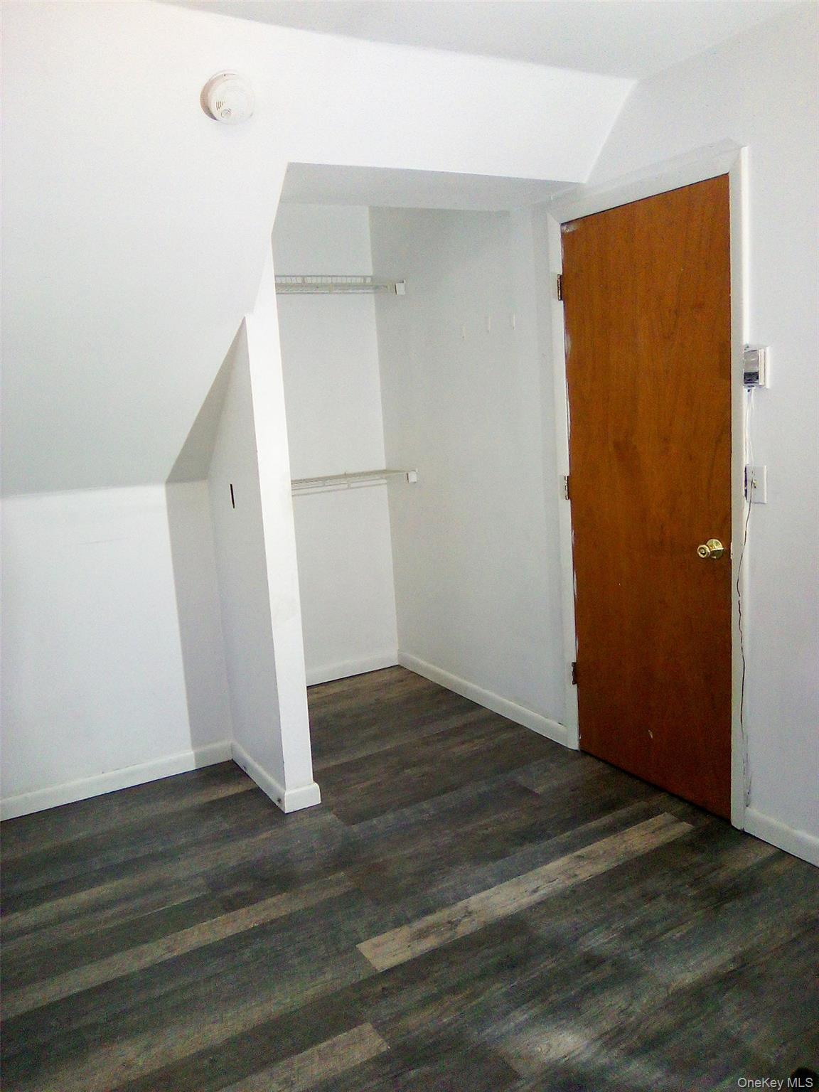 29 Schultz Road White Lake, NY 12786 - Photo 9 of 17 an empty room with wooden floor and entrance