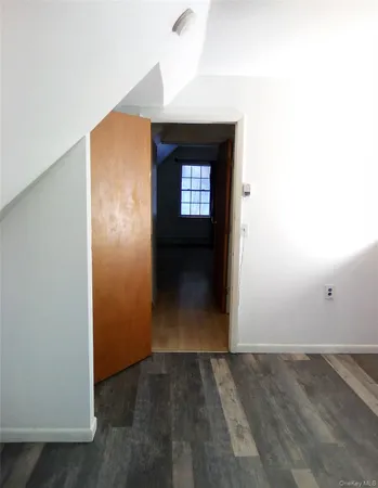 a view of a room wooden floor and a floor to ceiling window