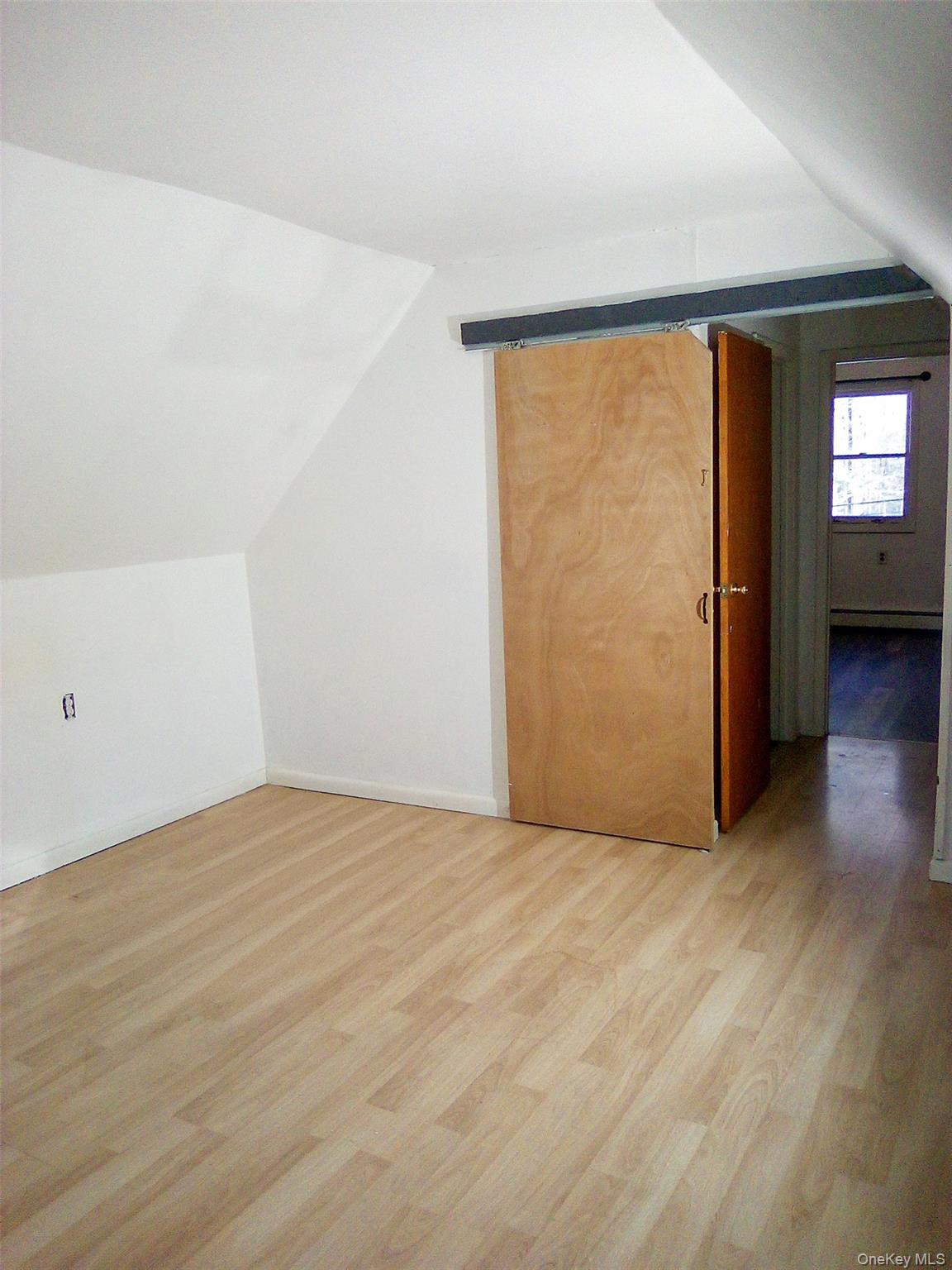 29 Schultz Road White Lake, NY 12786 - Photo 10 of 28 a view of an empty room with wooden floor and a window