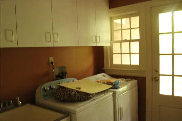 a bathroom with a sink and a window