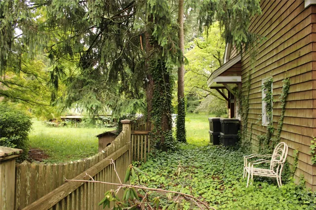 a view of a backyard of the house