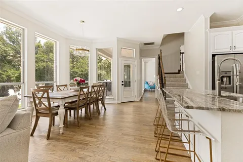 a view of a swimming pool with a patio and a yard