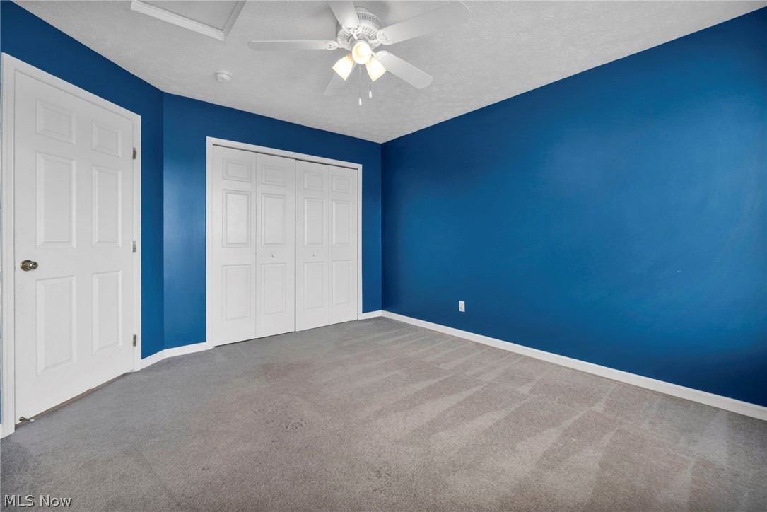 147 Stone Ridge Way Berea, OH 44017 - Photo 26 of 44 Unfurnished bedroom with carpet flooring, a closet, and ceiling fan