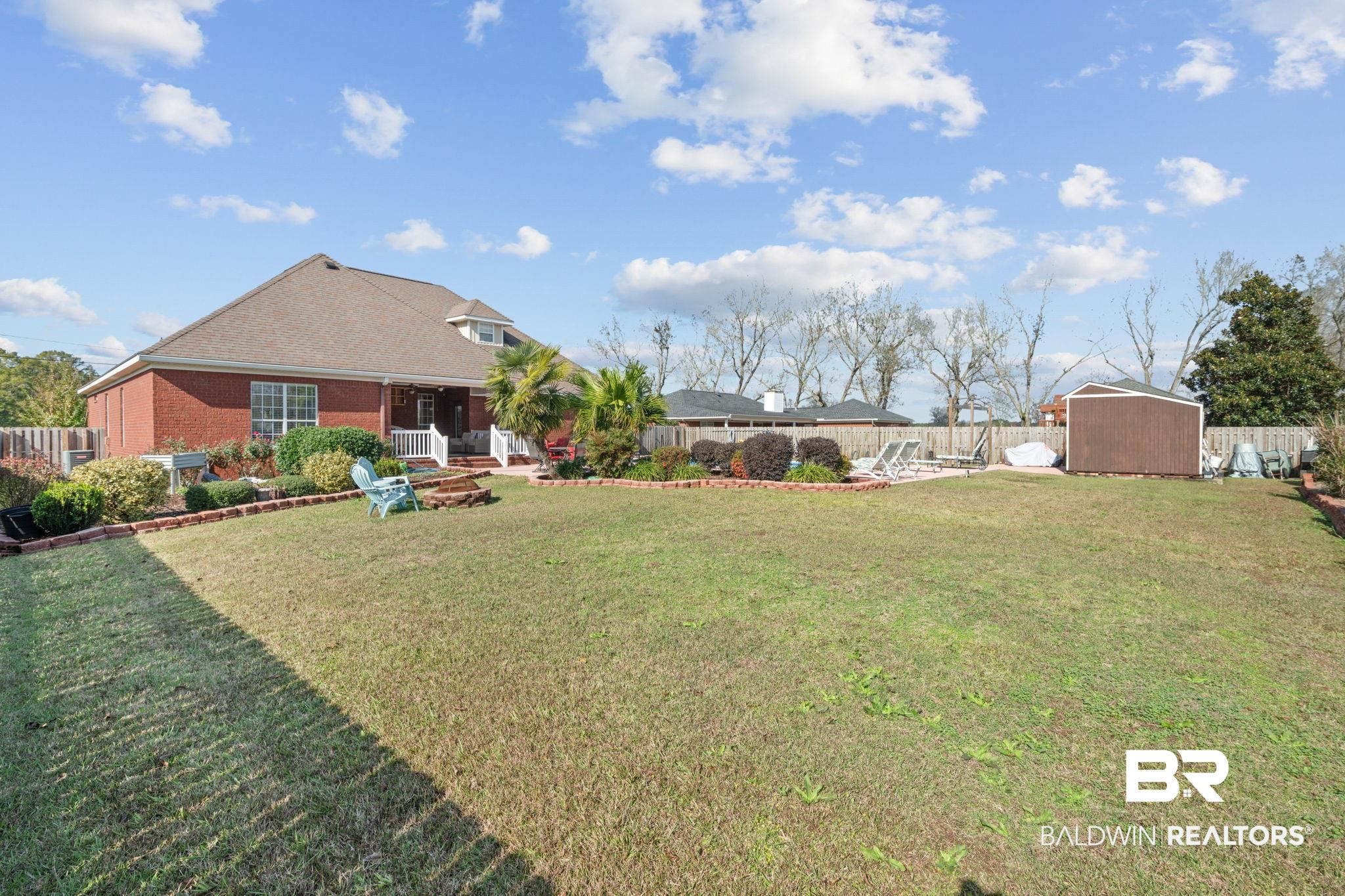 4771 Pecan Ridge East Mobile, AL 36619 - Photo 11 of 48 Fenced backyard with a storage shed