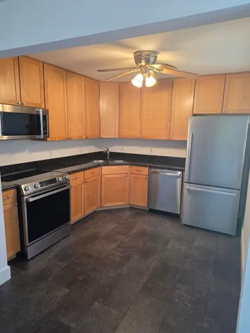 a kitchen with a sink and a refrigerator