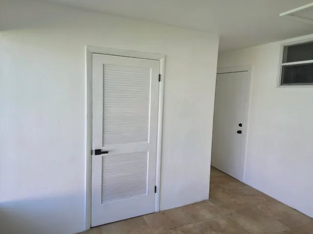 an empty room with wooden floor