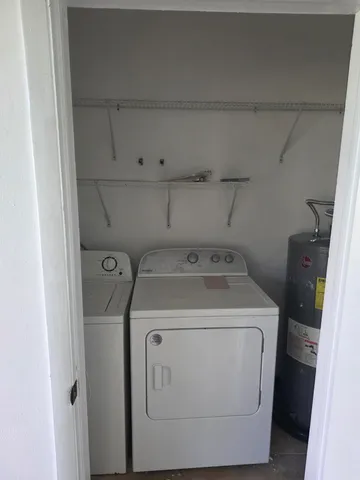 a utility room with dryer and washer