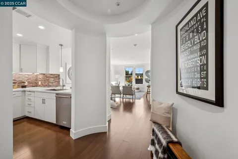 a kitchen with a refrigerator and a stove top oven