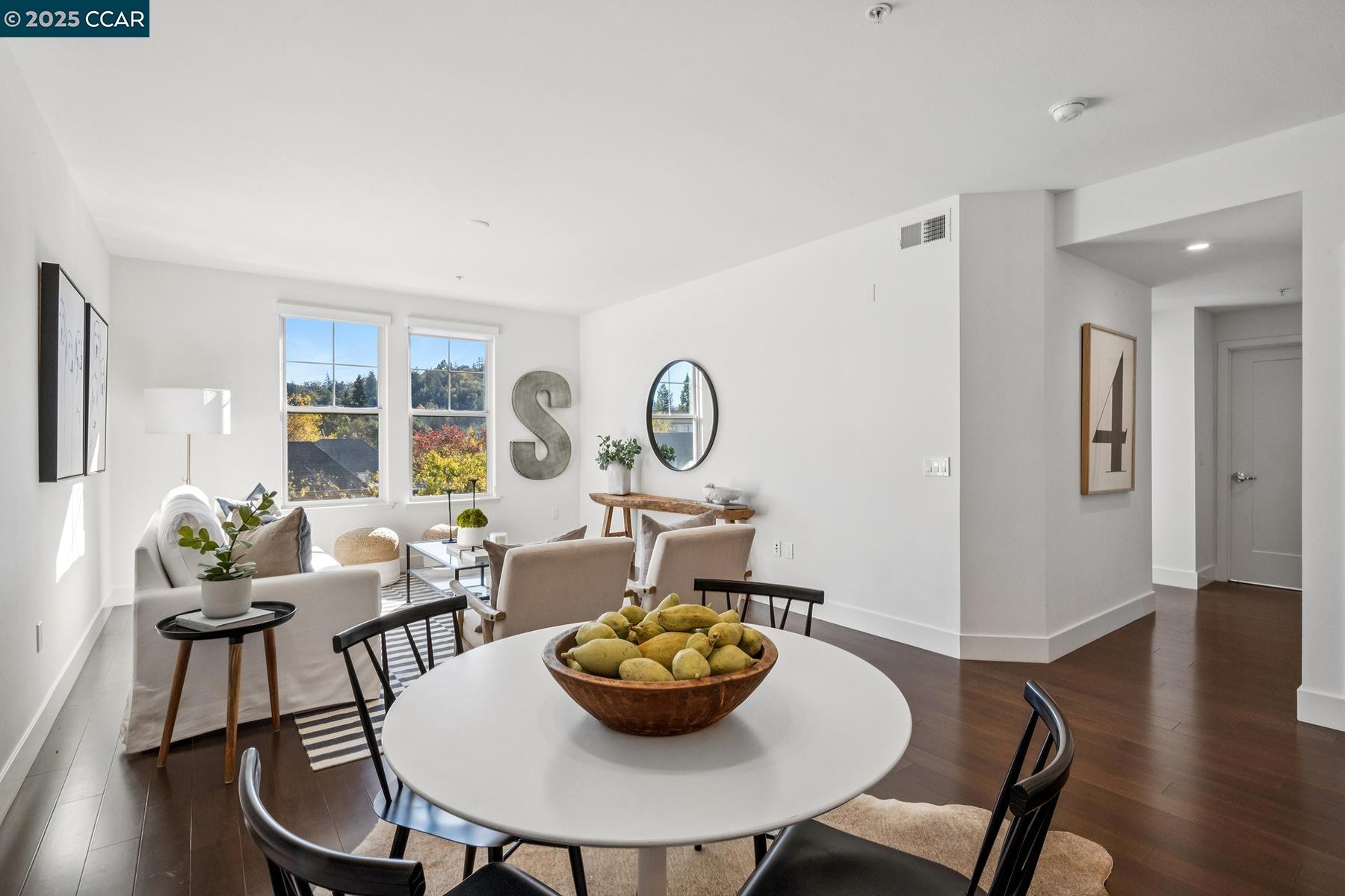 1000 Dewing Avenue, Unit 214 Lafayette, CA 94549 - Photo 10 of 23 a view of a dining room with furniture and wooden floor