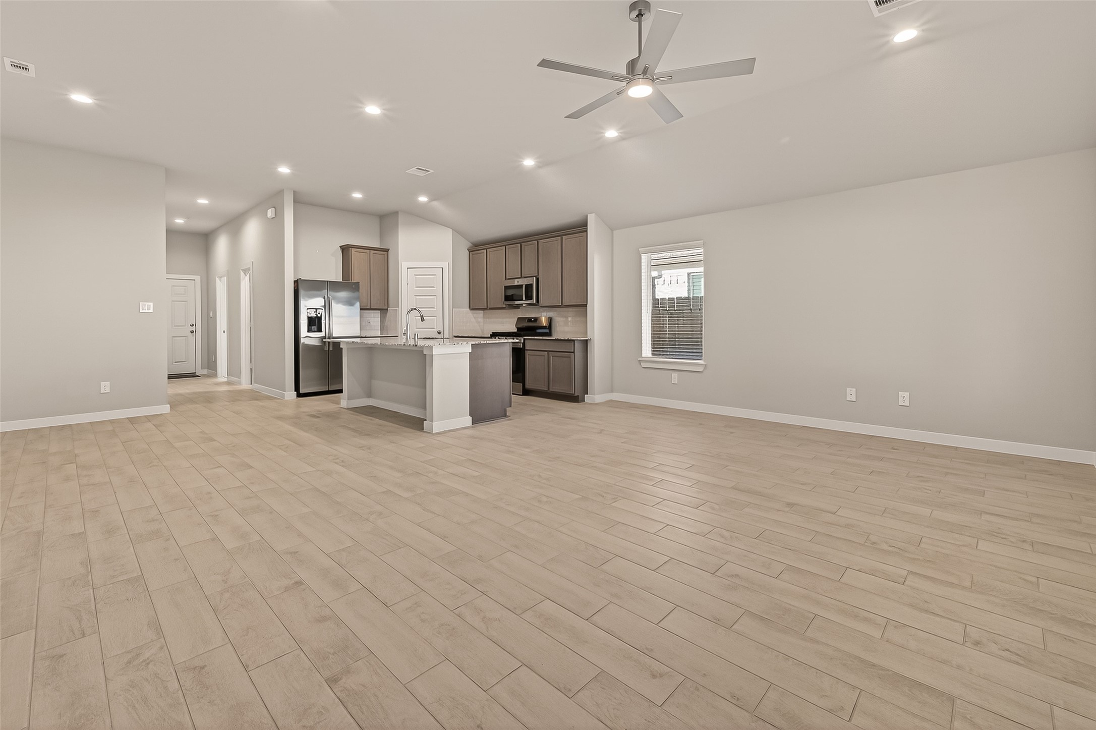 15710 Telge Road Cypress, TX 77429 - Photo 6 of 32 Spacious living area with abundant natural light